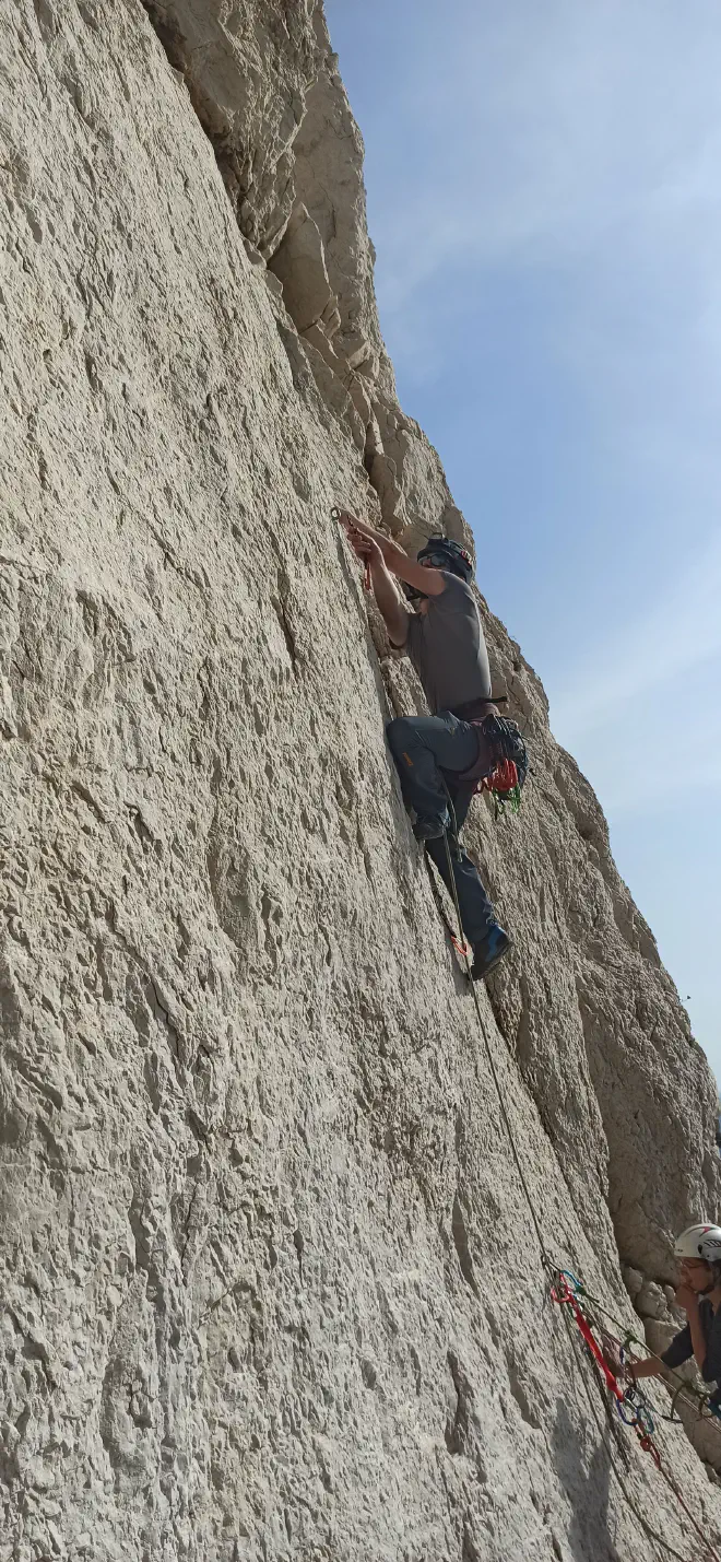 Nicolas clipping the second quickdraw on the third pitch of NTD, photo by Romual Terranova